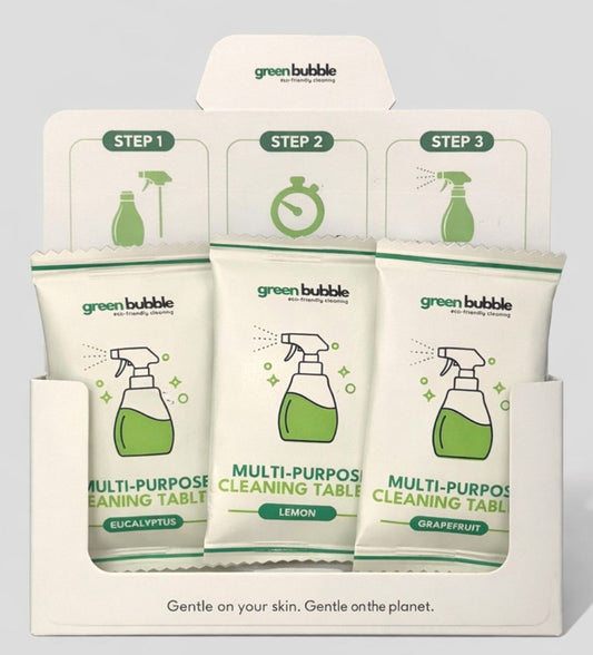 Green Bubble multi-purpose cleaning tablets packaging with three different scents on a gray background.