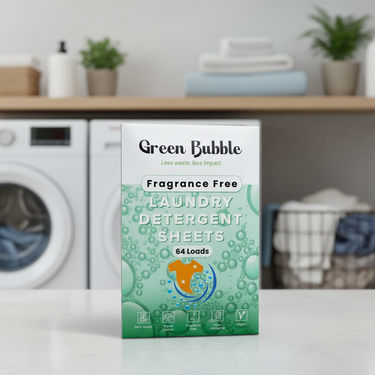 Box of Green Bubble laundry detergent sheets on a kitchen counter with a washing machine in the background.