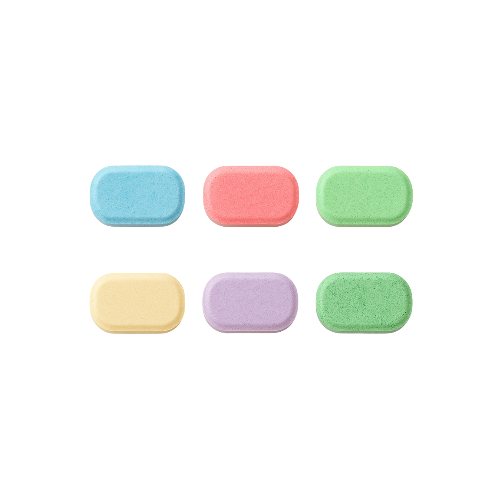 Set of six colorful eco-friendly hand soap foaming tablets on a white background