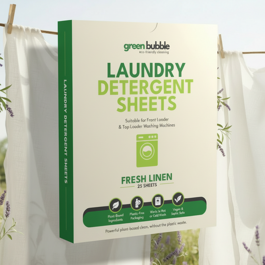 Box of Green Bubble laundry detergent sheets with white laundry in the background