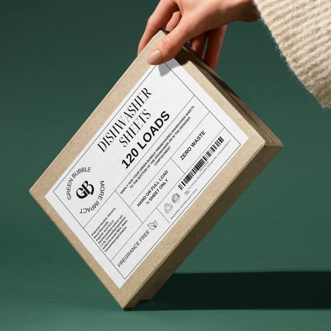 A hand is holding a cardboard box labeled 'Dishwasher Sheets 120 Loads' with a barcode and an eco-friendly message.